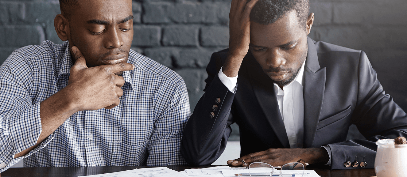 Business owners managing tax compliance